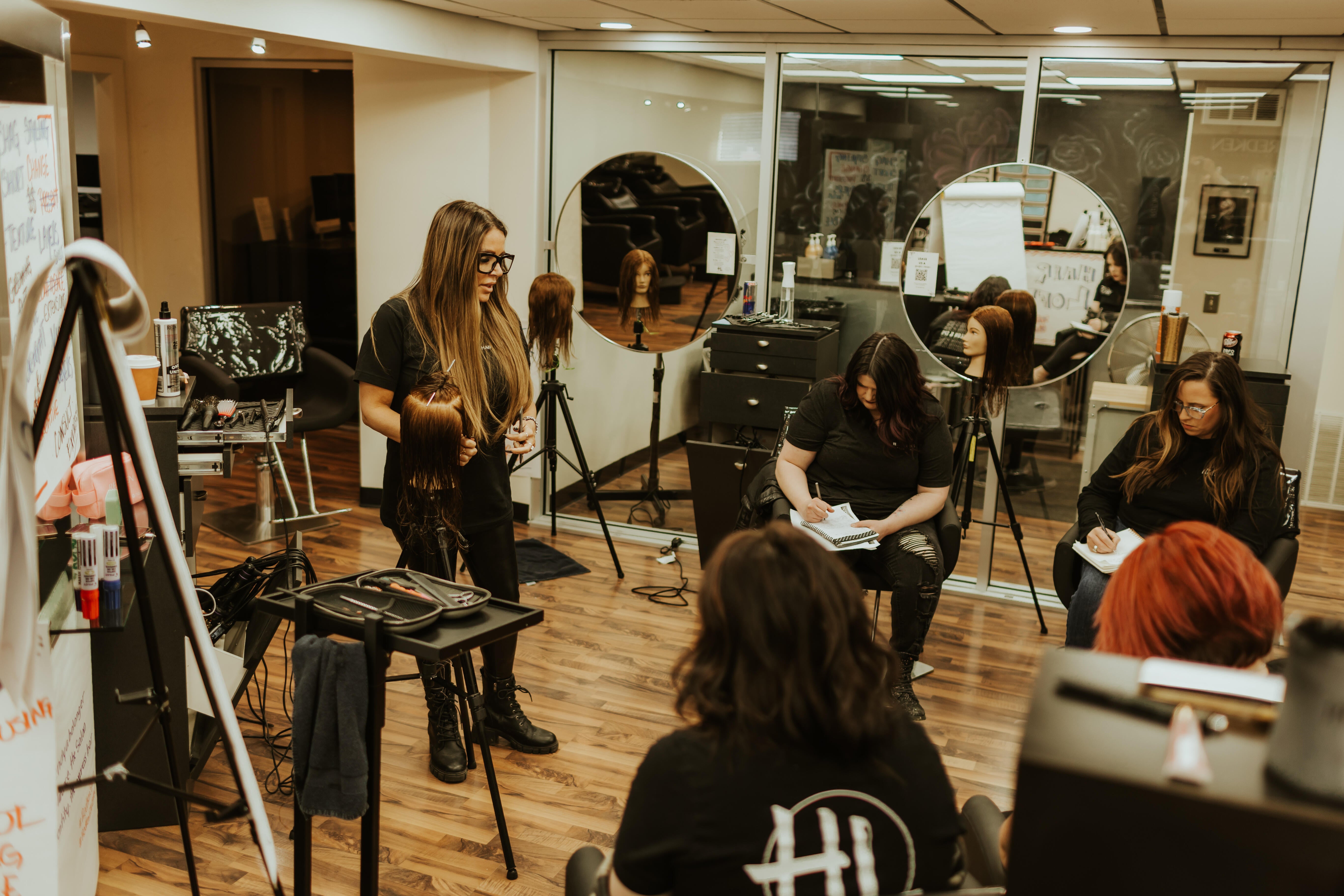 Learning new techniques in one of our many classes through the year at Hair Loft